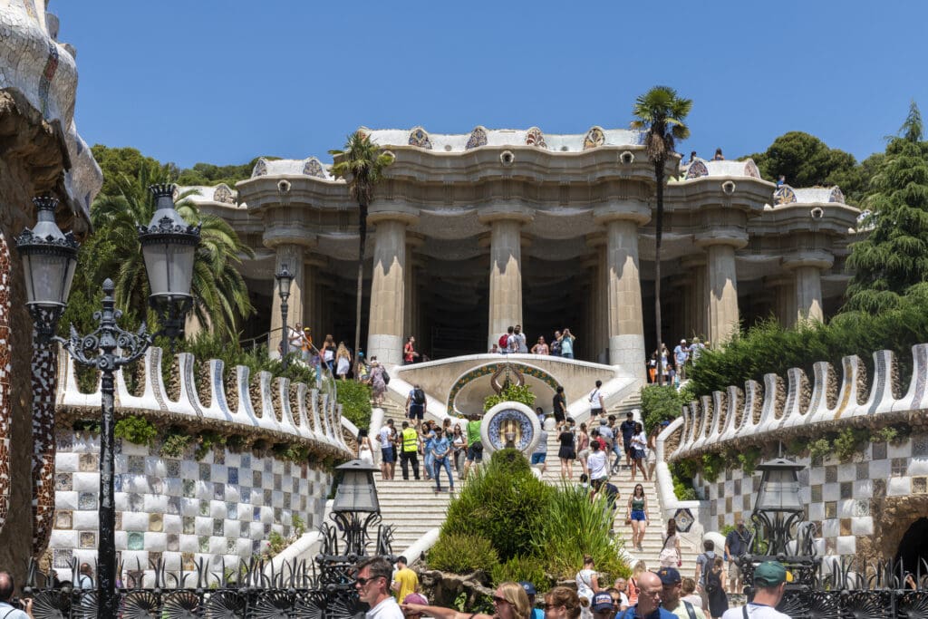 Gaudi in Barcelona entry way with elaborate mosaics either side of the grand stair case leading to the Guell Pavillions 