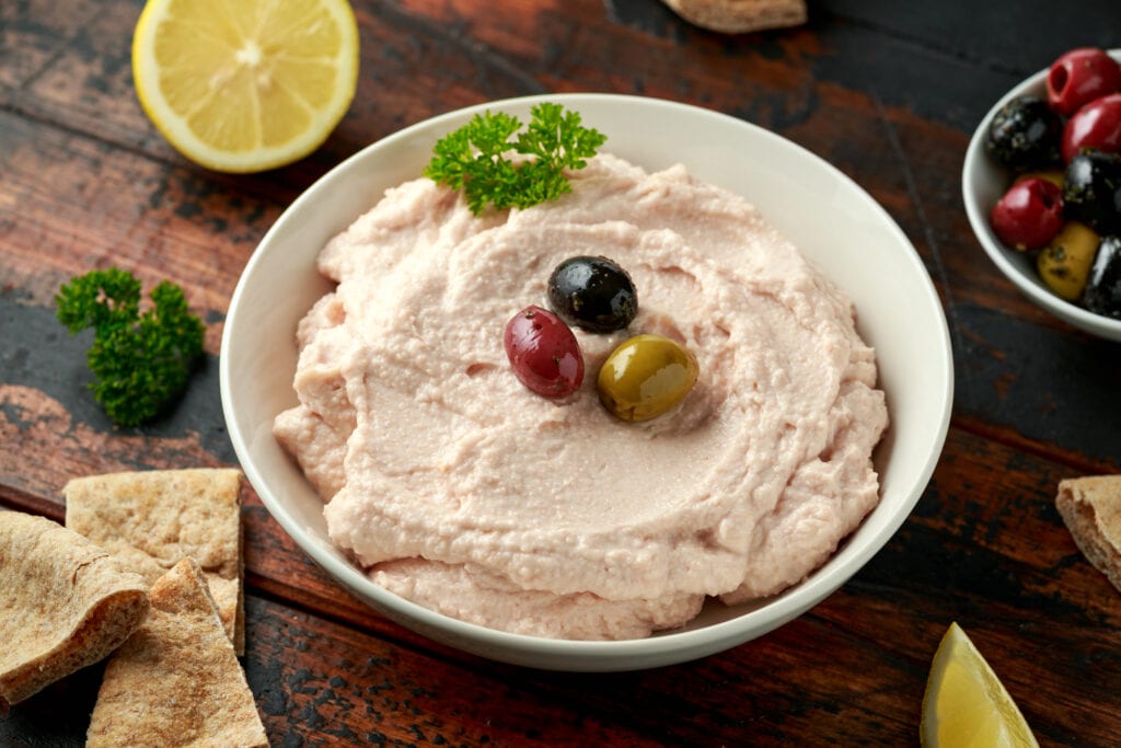 Taramasalata dip with pita bread and olives.