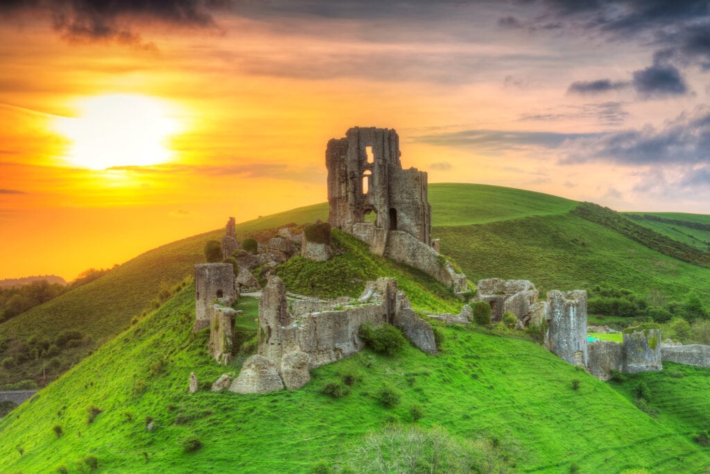 Ruins of the Corfe castle at beautiful sunrise in County Dorset, UK