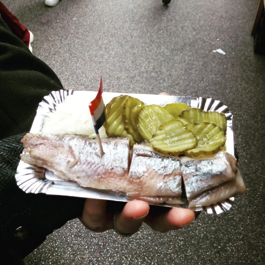 Traditional Dutch foods a favourite Dutch food is raw herring with pickles and white onions. The herring still has the scales on it and sits in a plastic tray with a Dutch flag and loaded with pickles and onions