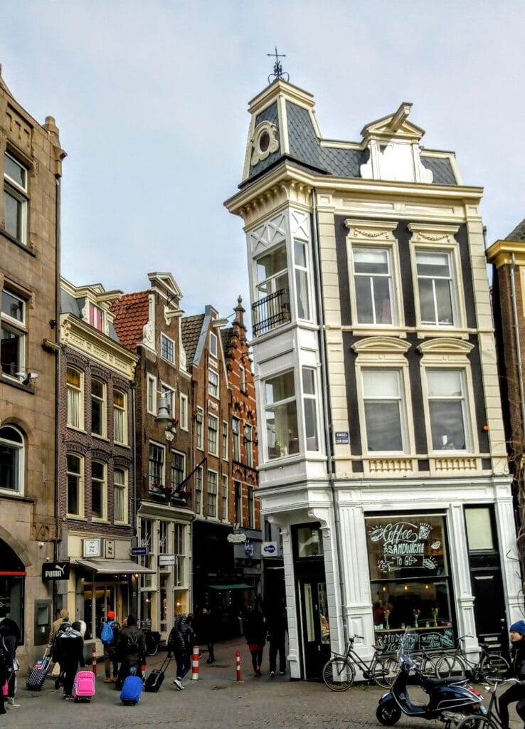 Amsterdam tips - one of the many crooked houses you can see in Amsterdam this one is along side a canal and has a cafe on the ground level