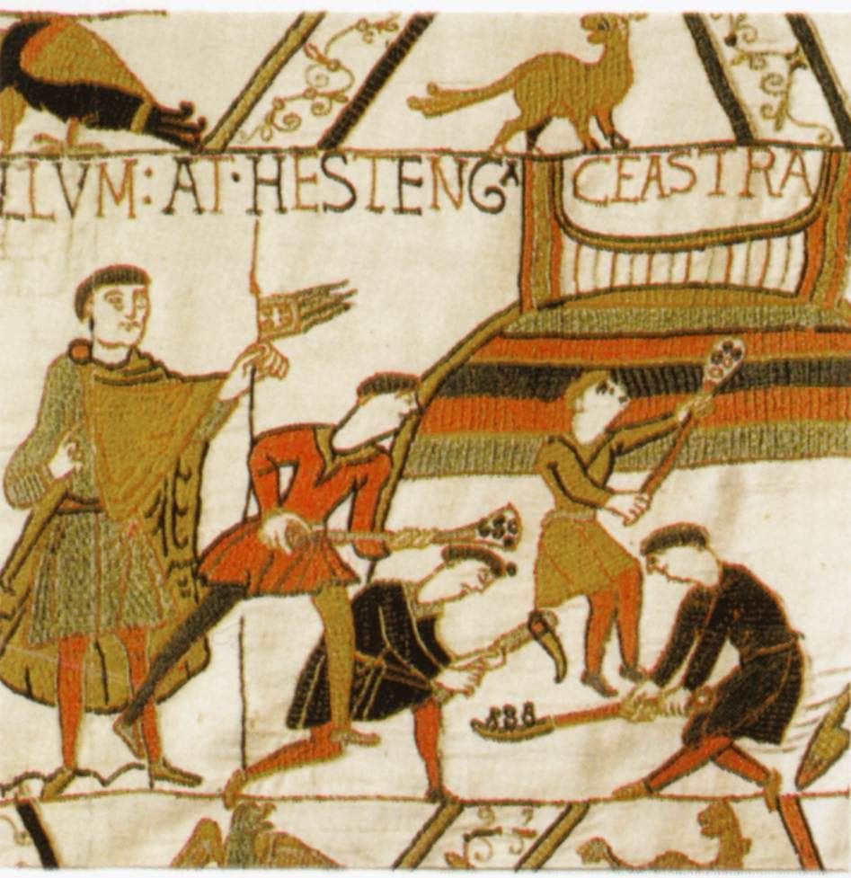 a piece of the Bayeux Tapestry showing men playing hurling type games