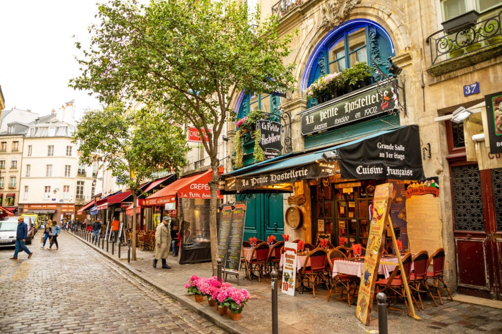 5 days in Paris the Latin Quarter. Narrow street of Paris among old traditional parisian houses and cafe in Paris in France