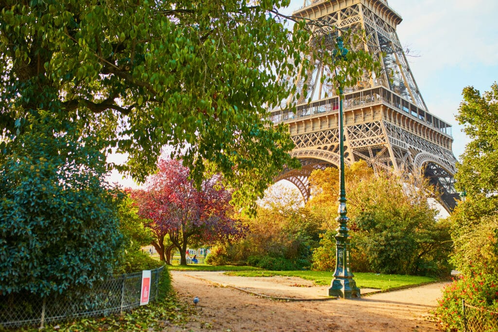 Scenic view of the Eiffel tower and Champ de Mars park on a beautiful and colorful autumn day