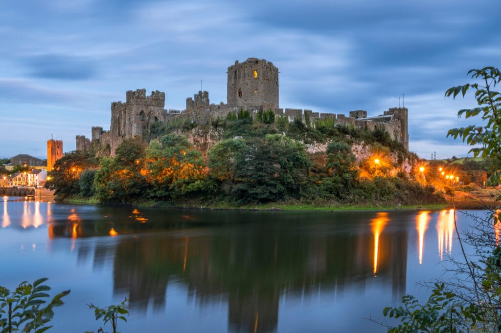 Pembroke, Wales, United Kingdom - September 22, 2016: Panoramic view of Pembroke Castle in South Wales at night