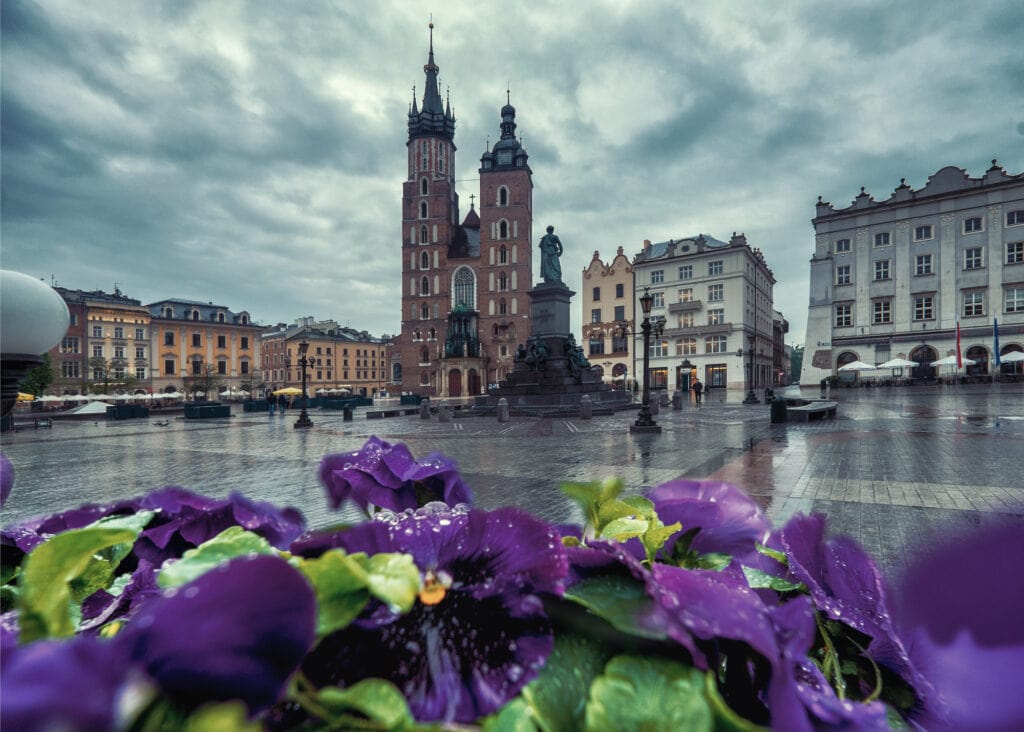 Market square in Krakow at sunrise. Mariacki Cathedral. Poland