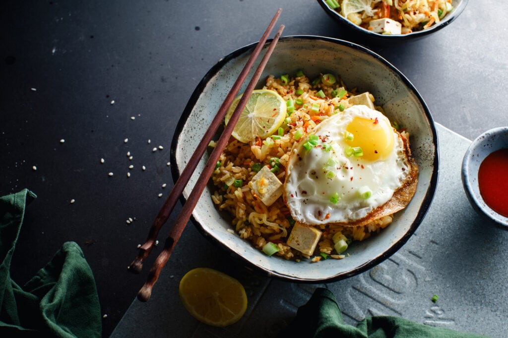 Vegetarian fried rice with tofu, peas and vegetables. Asian cuisine, healthy lunch