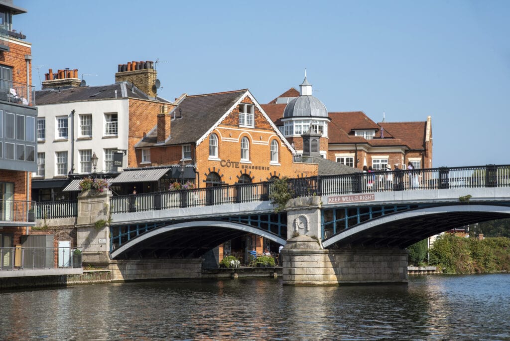 Eton, Buckinghamshire, England, UK. 2020. The Windsor and Eton bridge located between the two towns. Arched bridge made of iron and granite crossing the River Thames.