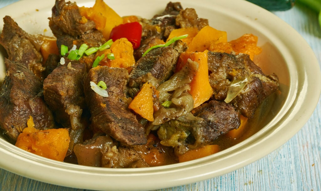 Guyanese, Pepperpot, meat stew, Caribbean cuisine, Traditional assorted  dishes, Top view.