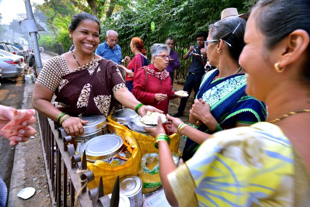 Mumbai, India - January 2017:Street trader cooking breakfast