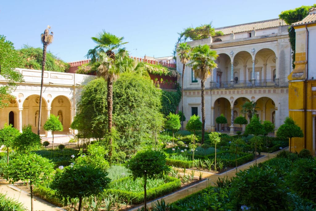 Courtyard with garden of Casa de Pilatos, Seville, Andalusia, Spain