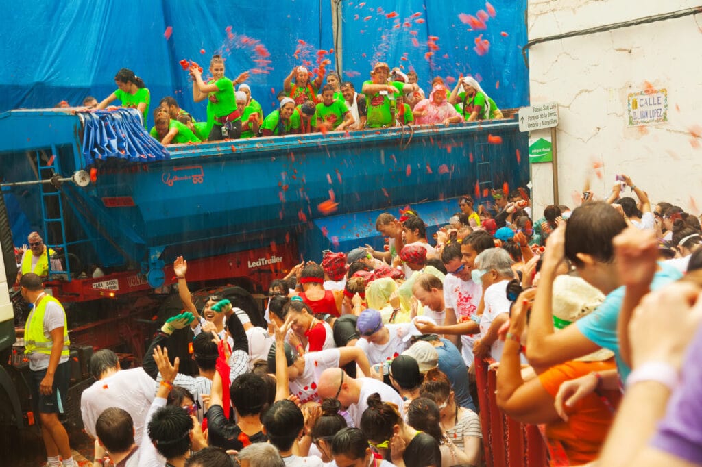 BUNOL, SPAIN - AUGUST 28: La Tomatina festival in August 28, 2013 in Bunol, Spain. Battle of tomatoes at street of spanish town