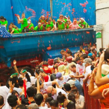 BUNOL, SPAIN - AUGUST 28: La Tomatina festival in August 28, 2013 in Bunol, Spain. Battle of tomatoes at street of spanish town