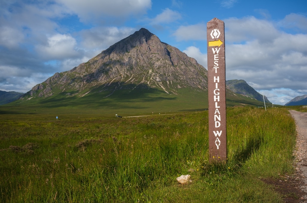 Buachaille Etive Mor and West Highland Way sign in Scotland. Touring the Scottish Highlands