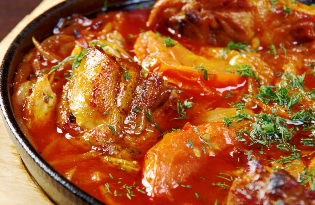 Zigini with injera - traditional Eritrean dish , spicy stew prepared with berbere spices