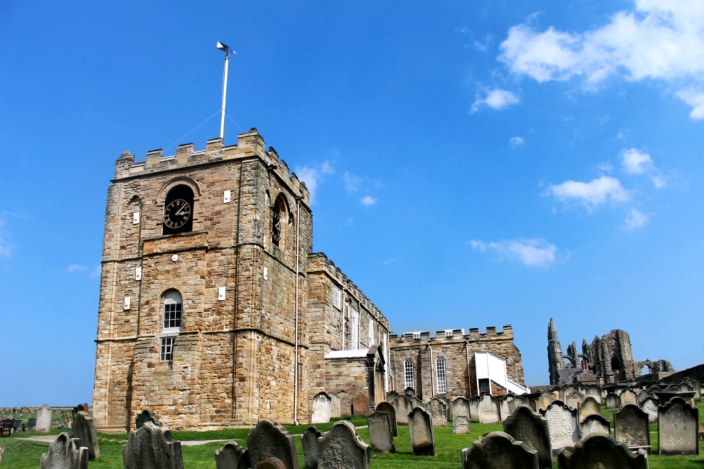 Scenic view of St. Marys Church in Whitby with graves in the foreground, North Yorkshire, England.