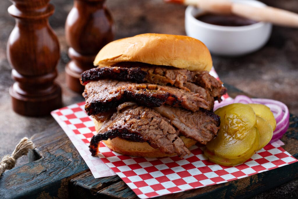 Smoked barbeque beef brisket sandwich with pickles