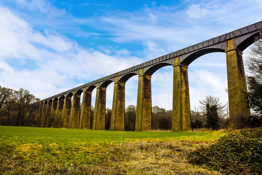 The impressive 18 stone arches and cast iron trough of the Pontcysyllte Aqueduct (the highest in the world) on the Ellesmere canal near Llangollen, Wales