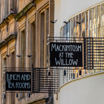 The setting sun shinning on the Charles Rennie Mackintosh signs for the Willow Tearoom on Sauchiehall Street in Glasgow, Scotland
