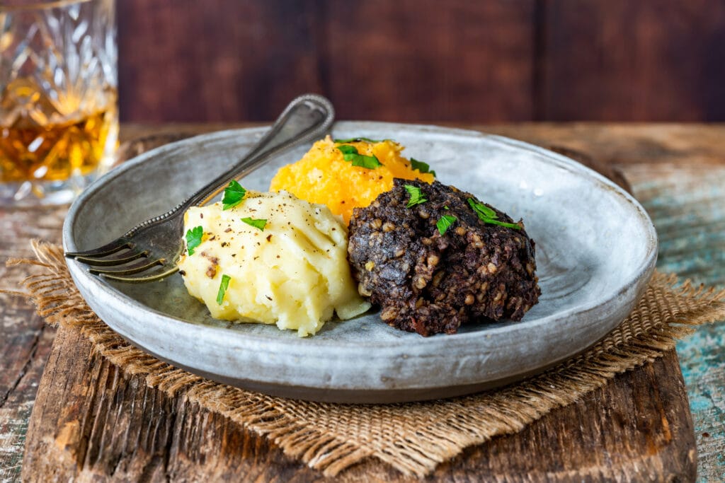 Haggis, neeps and tatties (haggis with turnips and potatoes) - traditional Scottish dish for Burns Night