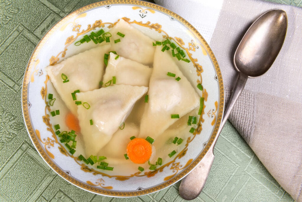Kreplach is kind of like ravioli a stuffed dough filled with finely chopped meats or cheese and seasoned with salt and pepper.  They are folded into triangles and then dropped into a soup to cook. 