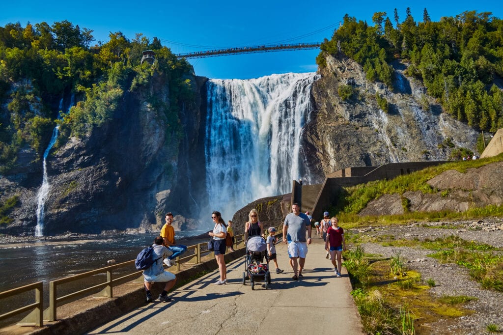 QUEBEC, CANADA - September 16, 2018: The Montmorency Falls is a waterfall on the Montmorency River in Quebec, Canada. The many tourists that visit there are treated to many ways to see the falls