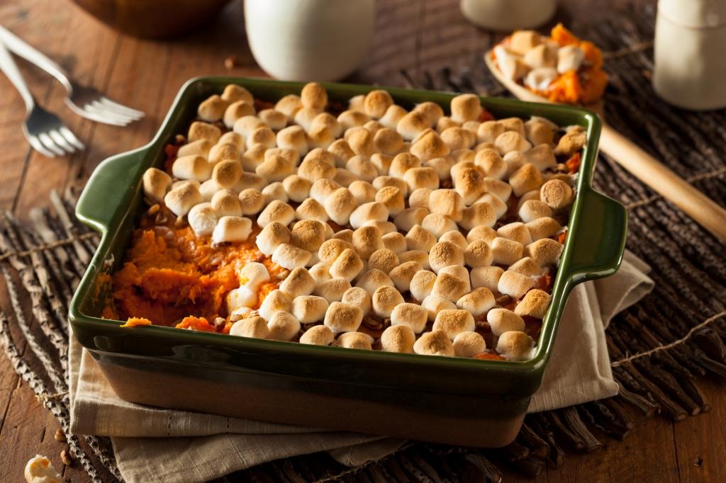 Sweet potato pie in a casserole dish, topped with marshmallows and grilled till toasty