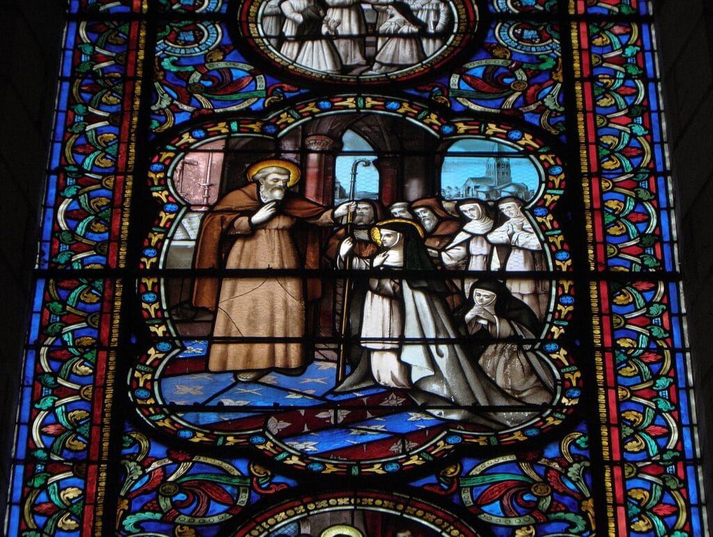 A stained glass window in Fontevraud Abbey, a historic church.