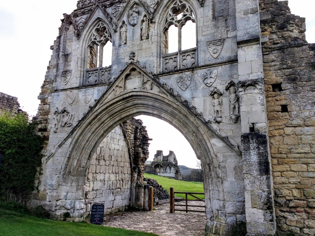 The stunning gothic gate entry to Kirkham Priory. With carved religious statues, gothic arches, decorated window embrasures and the coats of arms of the various owners from medieval times.