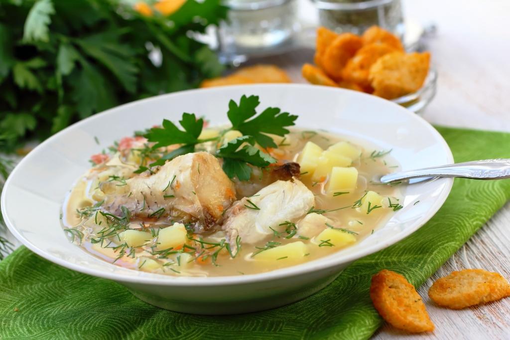 Fish soup. Delicious soup with white fish and vegetables for dinner