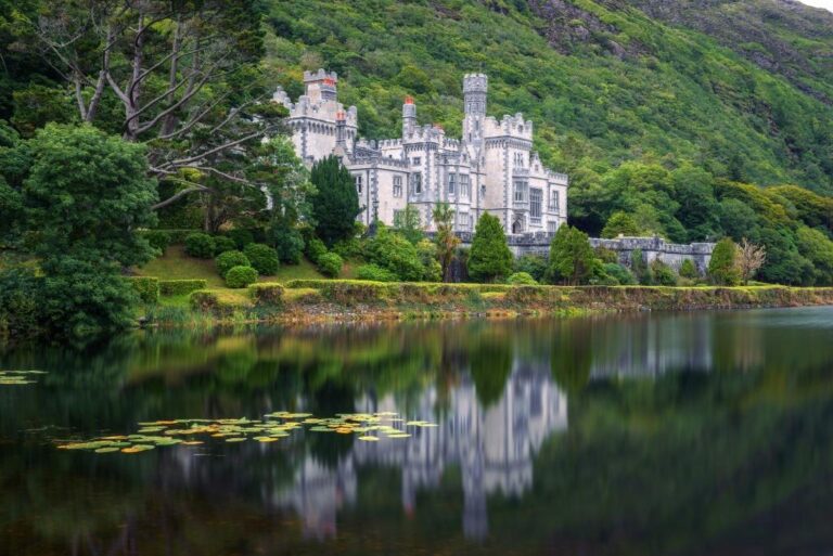 Kylemore Abbey in Connemara, County Galway, Ireland with reflections in the Pollacapall Lough. Kylemore Abbey is a Benedictine monastery founded in 1920 on the grounds of Kylemore Castle.