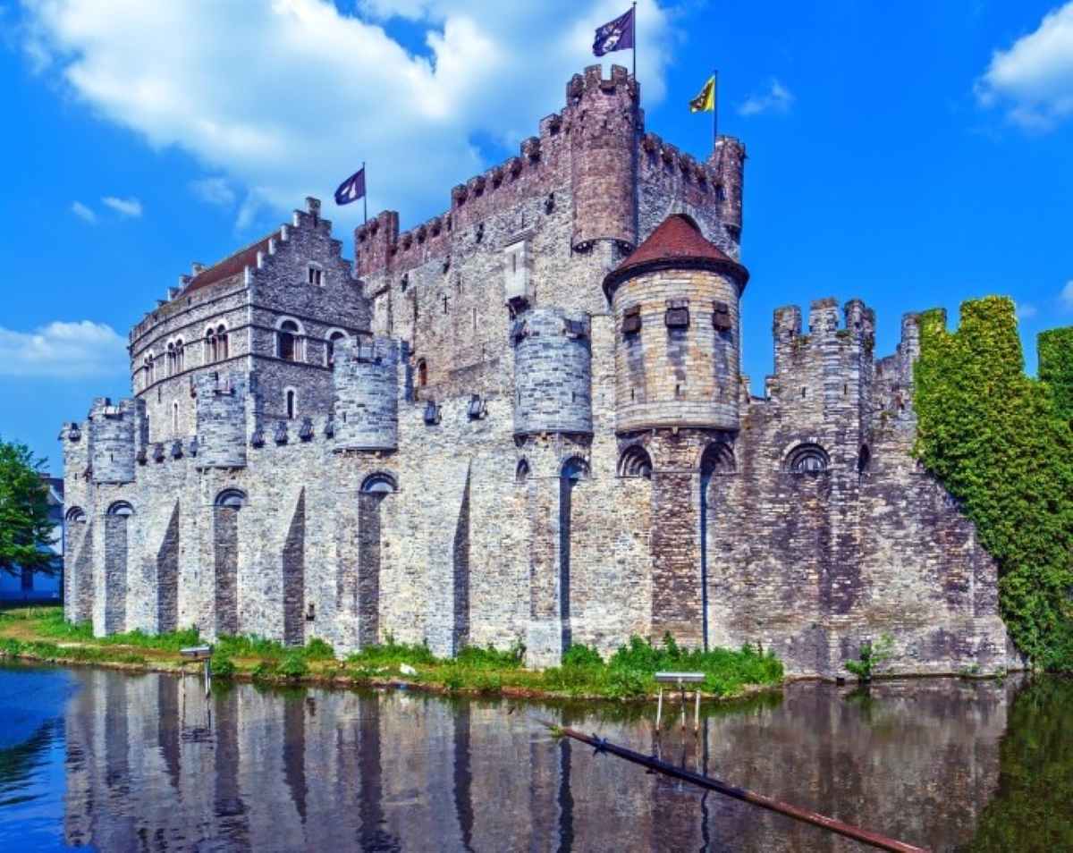 Ghent Castle reflected in the river