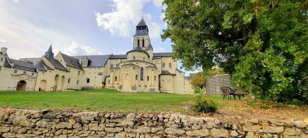 Fontevraud abbey a honey coloured collection of stone buildings with grey slate roofs