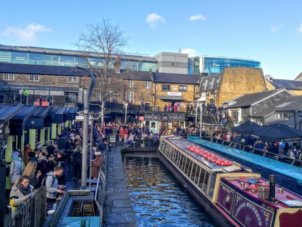 LONDON, UK - DECEMBER 30, 2018: Visitors at Camden Lock. Camden Lock, Camden Market, and streets nearby are the fourth-most popular attraction in the city, attracting 100,000 people each weekend