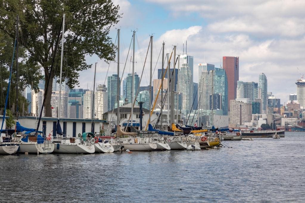 TORONTO, CANADA - SEPTEMBER 19, 2018: Marina at Toronto Island, and beautiful Toronto's skyline over lake. Toronto, Ontario, Canada.