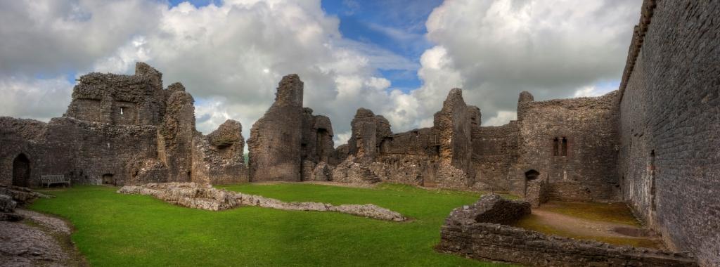 Ruined medieval castle landscape with dramatic sky historic cities in Wales