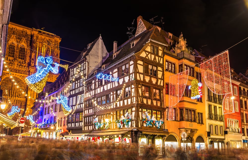 Christmas in France the lights and medieval buildings of Strasbourg lit up with ranges, twinkling lights, santa claus etc