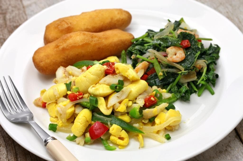 In Jamaica, there is an amazing fried dumpling called a “festival” for that reason. Unlike typical Jamaican dumplings, this one is sweet with a crunchy outside and a light, fluffy centre. There are a variety of recipes, but flour, cornmeal, sugar, and baking powder are generally a part of it.