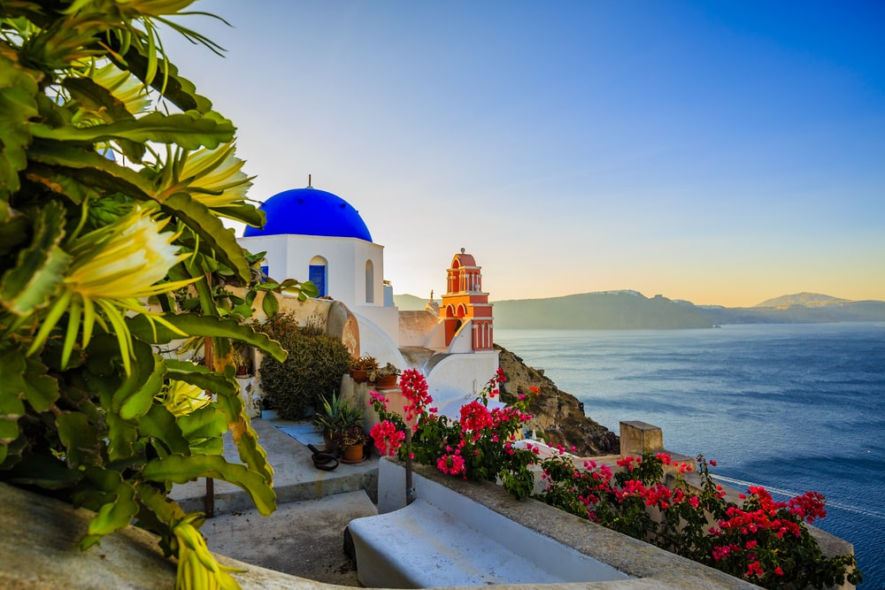 Amazing view with white houses in Oia village on Santorini island in Greece.