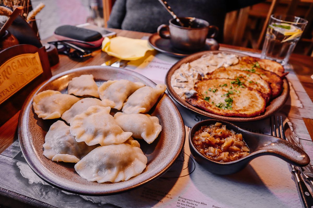 A table full of platters of piergi