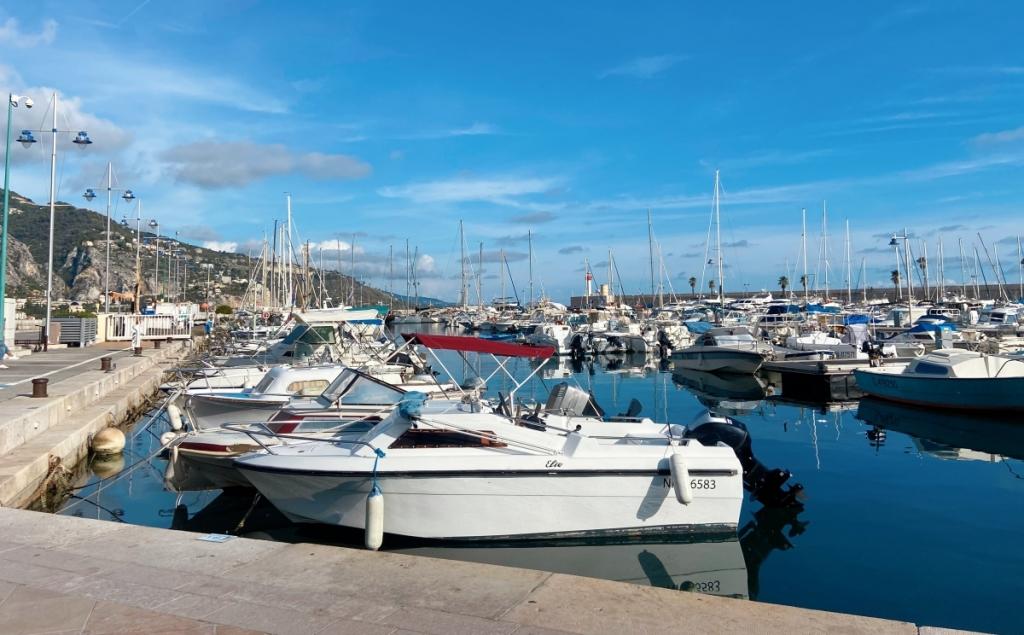 the port of Menton with lots of fancy boats, yachts and ships belonging to the rich