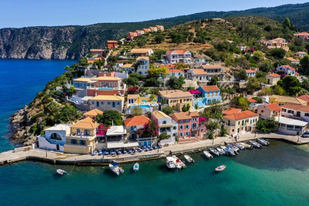 Kefalonia Greece the harbour with fishing boats and the Village with red tiled roofs