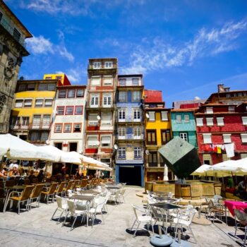 PORTO, PORTUGAL - JUNE, 11: Tourists visit restaurants at famous place Ribeira Square on June 11, 2015 in Porto, Portugal