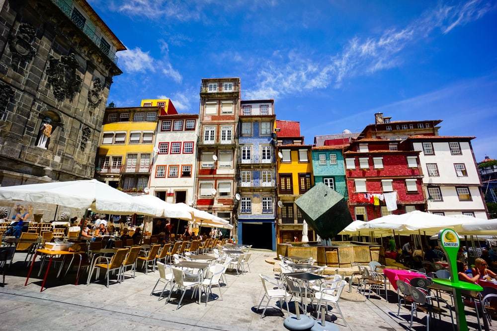 PORTO, PORTUGAL - JUNE, 11: Tourists visit restaurants at famous place Ribeira Square on June 11, 2015 in Porto, Portugal