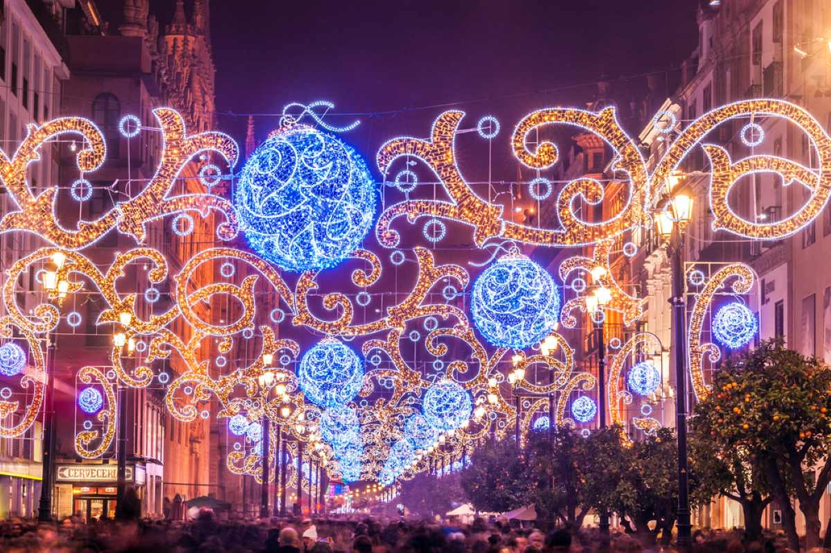 Christmas lights in Seville hanging above all the streets filled with tourists