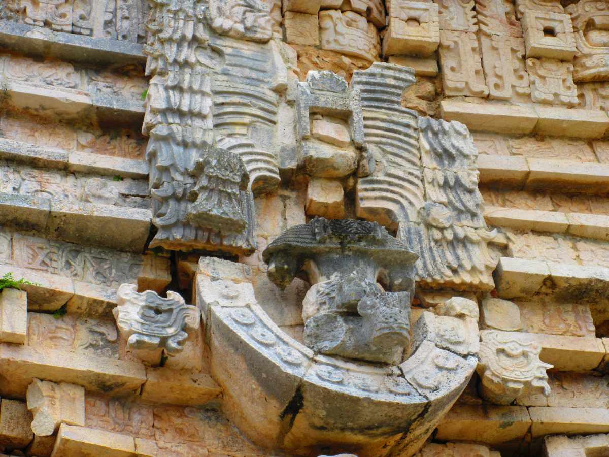 a bird shaped carving at uxmal
