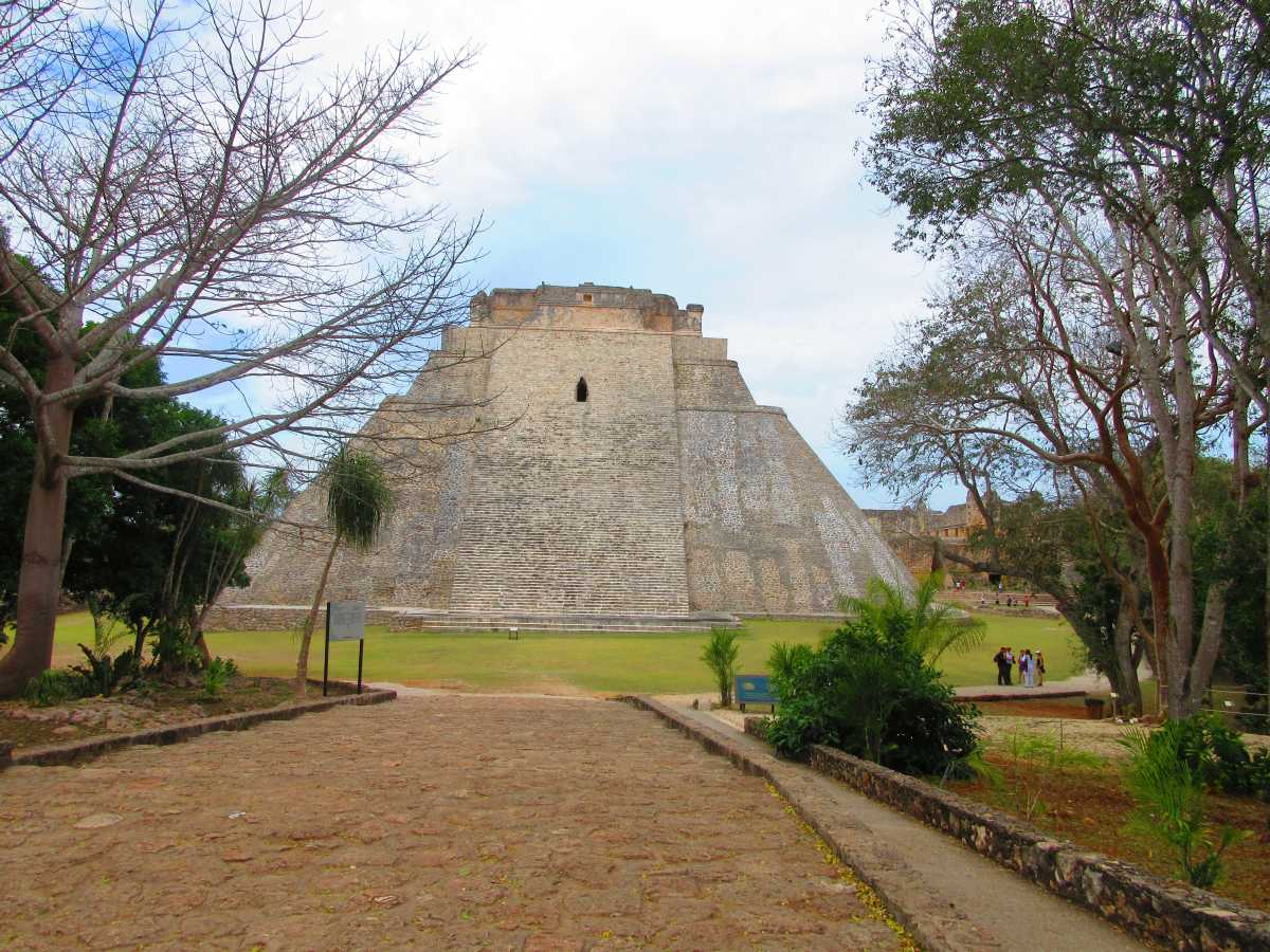Entry way to Uxmal a gravel walkway leads to the pyramids