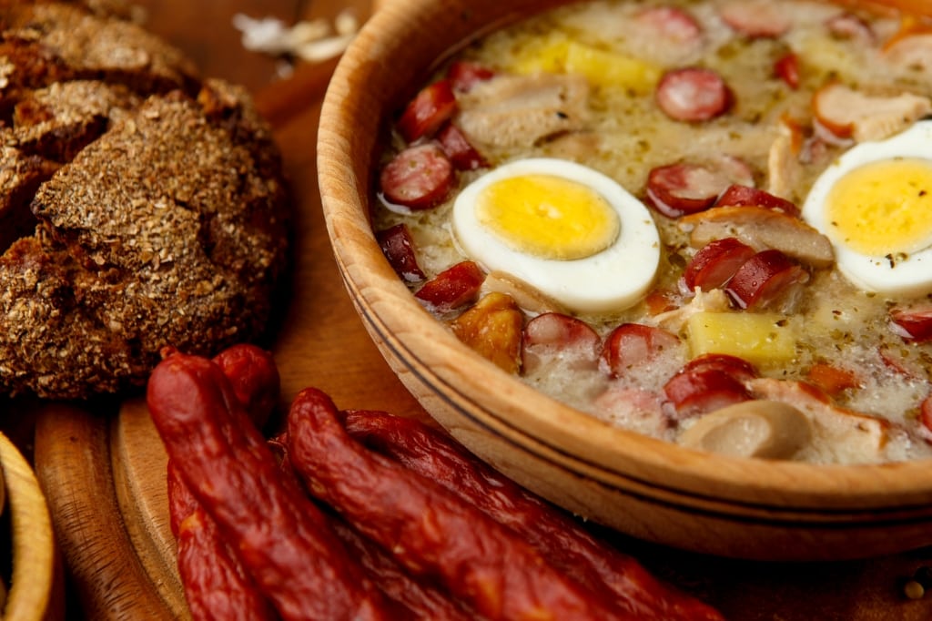 Traditional Zurek with sausage and egg, white borscht, polish homemade Easter soup
