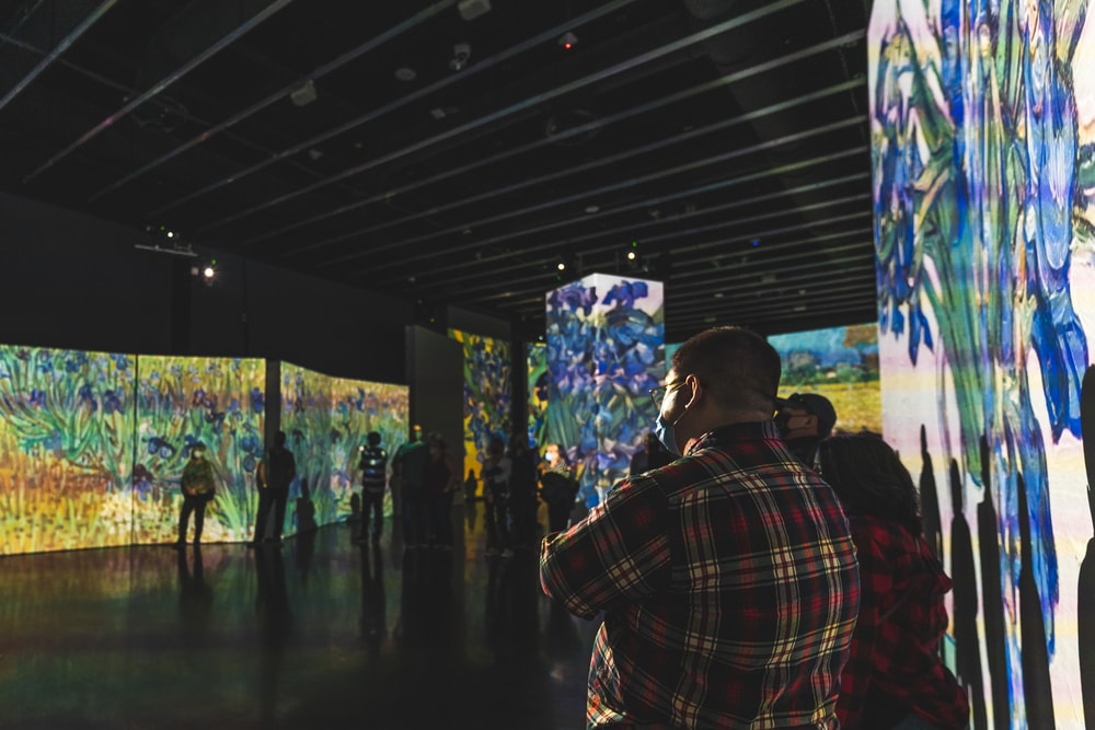 People take in the immersive Van Gogh Alive Exhibit 