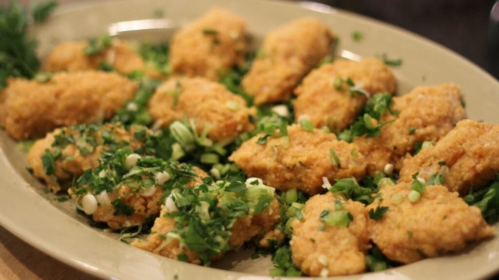 Armenian-style fried chicken nuggets with chives and parsley.